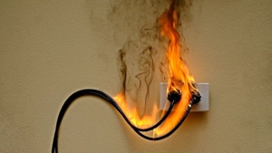 bigstock-On-Fire-Electric-Wire-Plug-Rec-388489015.jpg